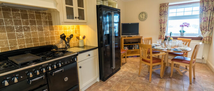 Apple-House-Kitchen www.loaninghead.co.uk holiday cottage Apple House, kitchen with table set for dinner. Loch Lomond and Trossachs National Park